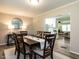 Elegant dining room with a wood table set for six, soft lighting, and an open layout at 1612 Bethlehem Rd, Knightdale, NC 27545