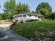 Scenic view of home with a sprawling lawn and partially finished basement at 1612 Bethlehem Rd, Knightdale, NC 27545