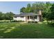 Beautiful ranch home with a well-manicured lawn, charming front porch, and inviting curb appeal at 1612 Bethlehem Rd, Knightdale, NC 27545