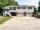 Two-story home featuring a two-car garage and a well-maintained driveway with landscaping at 1612 Bethlehem Rd, Knightdale, NC 27545
