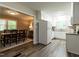 Bright eat-in kitchen leading to a formal dining room, hardwood floors, and neutral paint at 1612 Bethlehem Rd, Knightdale, NC 27545