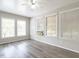 Bright sunroom with natural light streaming in through the many windows and wood-look floors at 1612 Bethlehem Rd, Knightdale, NC 27545