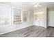 Bright sunroom with washer, dryer, ample windows, and wood-look floors at 1612 Bethlehem Rd, Knightdale, NC 27545