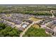 Aerial view of community with pool, trees and well maintained landscaping at 1612 Old Bramble Ln, Fuquay Varina, NC 27526