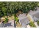 Aerial view of a home with a large, treed backyard, showcasing privacy and outdoor space in a residential area at 1612 Old Bramble Ln, Fuquay Varina, NC 27526