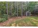 Spacious backyard with mature trees, storage shed and lush green lawn at 1612 Old Bramble Ln, Fuquay Varina, NC 27526