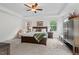 Bright bedroom with a large bed, and neutral colored walls and carpet at 1612 Old Bramble Ln, Fuquay Varina, NC 27526