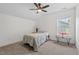 Bright bedroom with ample space, a ceiling fan, and a window showcasing natural light at 1612 Old Bramble Ln, Fuquay Varina, NC 27526
