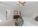 Large bedroom with adjoining closet and a decorative painting on the wall at 1612 Old Bramble Ln, Fuquay Varina, NC 27526