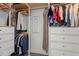 Organized walk-in closet with built-in shelves and hanging space at 1612 Old Bramble Ln, Fuquay Varina, NC 27526