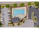Aerial view of the community pool, with lounge chairs for relaxing and ample parking at 1612 Old Bramble Ln, Fuquay Varina, NC 27526