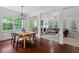 Inviting dining room with hardwood floors that connects to the home's open-concept living spaces at 1612 Old Bramble Ln, Fuquay Varina, NC 27526