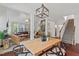 Bright dining room with an adjacent living space with a view of the home's staircase at 1612 Old Bramble Ln, Fuquay Varina, NC 27526