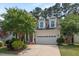Charming home featuring well-maintained landscaping and a two-car garage at 1612 Old Bramble Ln, Fuquay Varina, NC 27526