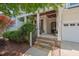Welcoming front porch with stone steps, cozy decor, and a charming entrance at 1612 Old Bramble Ln, Fuquay Varina, NC 27526
