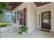 Relaxing front porch with rocking chairs, stylish decor, and a welcoming entrance at 1612 Old Bramble Ln, Fuquay Varina, NC 27526