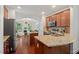 Well-equipped kitchen with stainless steel appliances, granite counters, and ample cabinet space at 1612 Old Bramble Ln, Fuquay Varina, NC 27526
