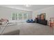 Bright living room with large windows, comfortable seating, and natural light at 1612 Old Bramble Ln, Fuquay Varina, NC 27526