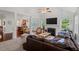 Open living space with hardwood floors and an adjacent dining and kitchen area at 1612 Old Bramble Ln, Fuquay Varina, NC 27526