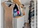 Well-organized walk-in closet with built-in shelving and hanging rods for ample clothing and accessory storage at 1612 Old Bramble Ln, Fuquay Varina, NC 27526