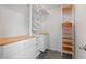 Organized walk-in closet featuring white shelving, drawers, and modern design at 1612 Old Bramble Ln, Fuquay Varina, NC 27526