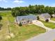 Aerial view showcasing a well-maintained home with an attached garage and green lawns at 191 Bridle Dr, Angier, NC 27501