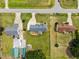 Aerial view showcasing the home's location, curb appeal, landscaping, and large backyard at 191 Bridle Dr, Angier, NC 27501