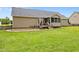 Spacious backyard featuring a patio area, a screened in porch, and plenty of lush green grass at 191 Bridle Dr, Angier, NC 27501