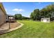 Large, grassy backyard perfect for outdoor activities and entertaining guests at 191 Bridle Dr, Angier, NC 27501