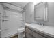 Bright bathroom featuring a shower over bath and vanity with modern fixtures at 191 Bridle Dr, Angier, NC 27501