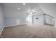 Large bonus room with carpet, angled ceilings, and potential for multi-use space at 191 Bridle Dr, Angier, NC 27501