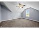 Bright bonus room featuring high ceilings, carpet, fan, and window at 191 Bridle Dr, Angier, NC 27501