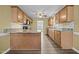 The kitchen features wooden cabinets, modern appliances, tile backsplash, and hardwood floors at 191 Bridle Dr, Angier, NC 27501