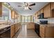 This kitchen features wood cabinets, modern appliances, and hardwood floors at 191 Bridle Dr, Angier, NC 27501