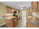 The beautiful kitchen is equipped with wooden cabinets, modern appliances, and plenty of counter space at 191 Bridle Dr, Angier, NC 27501