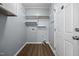 The laundry room includes shelving and an access door to the exterior at 191 Bridle Dr, Angier, NC 27501