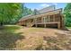 Exterior showcasing a wooden deck with stairs, perfect for outdoor entertaining and relaxation at 2015 Saddlebrook Dr, Archer Lodge, NC 27527