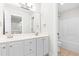 Bright bathroom with double vanity, tub and shower combo, and ample mirror space at 2015 Saddlebrook Dr, Archer Lodge, NC 27527