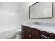 Bathroom features a vanity with marble countertop and a shower-tub combo at 2015 Saddlebrook Dr, Archer Lodge, NC 27527
