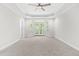 Spacious main bedroom with carpet features tray ceiling and access to a balcony at 2015 Saddlebrook Dr, Archer Lodge, NC 27527