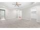 Spacious main bedroom with carpet features tray ceiling and access to the bathroom at 2015 Saddlebrook Dr, Archer Lodge, NC 27527