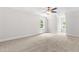 Spacious, carpeted bedroom with natural light from large windows at 2015 Saddlebrook Dr, Archer Lodge, NC 27527