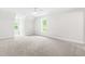 Spacious, carpeted bedroom with natural light from large windows, ready for personalization at 2015 Saddlebrook Dr, Archer Lodge, NC 27527