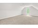 Carpeted bonus room with a dormer window, offering ample natural light at 2015 Saddlebrook Dr, Archer Lodge, NC 27527