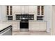 Well-lit kitchen with stainless steel range and black-and-white backsplash at 2015 Saddlebrook Dr, Archer Lodge, NC 27527
