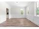 Bright and open living room with wood floors and lots of natural light at 2015 Saddlebrook Dr, Archer Lodge, NC 27527