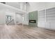 Bright, open living room with fireplace, built-in bookshelves, and staircase at 2015 Saddlebrook Dr, Archer Lodge, NC 27527
