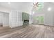 Spacious living room featuring a fireplace, built-in bookshelves, and vaulted ceiling at 2015 Saddlebrook Dr, Archer Lodge, NC 27527
