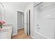Bright bathroom featuring dual vanity, tub, and convenient closet space at 2018 Remington Oaks Cir, Cary, NC 27519