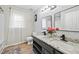 Bathroom features double sinks, granite countertop, and grey cabinets at 2018 Remington Oaks Cir, Cary, NC 27519